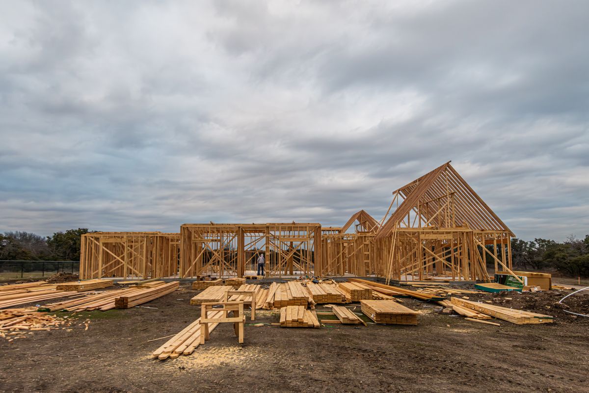 Exposed timber framing during construction of a house roof